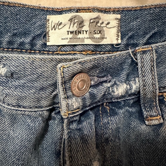 We the Free denim shorts. Frayed hem with floral details in distressed areas. - Picture 3 of 5